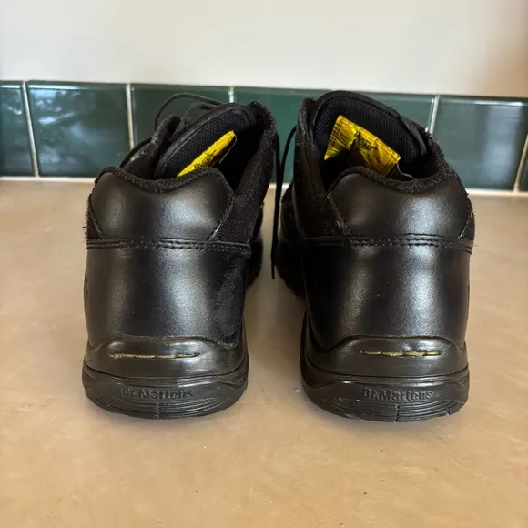 Black leather Dr. Martens industrial steel toe shoes men’s US size 10 women’s 11
