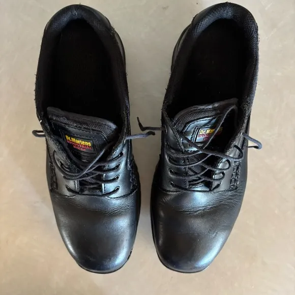 Black leather Dr. Martens industrial steel toe shoes men’s US size 10 women’s 11