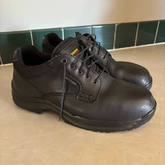 Black leather Dr. Martens industrial steel toe shoes men’s US size 10 women’s 11