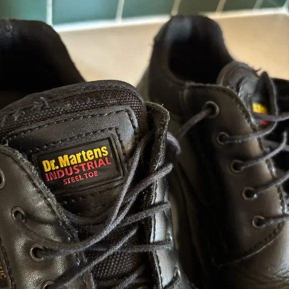 Black leather Dr. Martens industrial steel toe shoes men’s US size 10 women’s 11