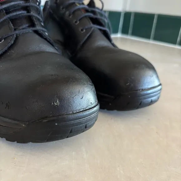 Black leather Dr. Martens industrial steel toe shoes men’s US size 10 women’s 11