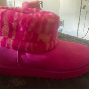Hot pink zebra and orange print mini boots UGG