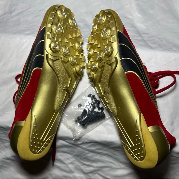 Mens Puma Complete Theseus Track And Field Shoes size 11 1/2. Red Suede and Gold