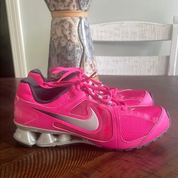 Nike Pink and Silver Athletic Shoes with Sleek Design