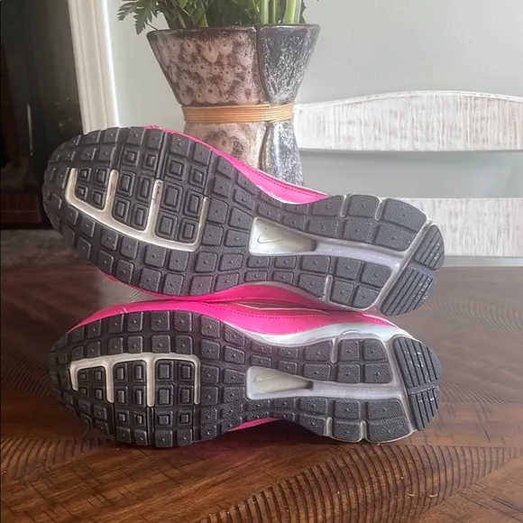 Nike Pink and Silver Athletic Shoes with Sleek Design