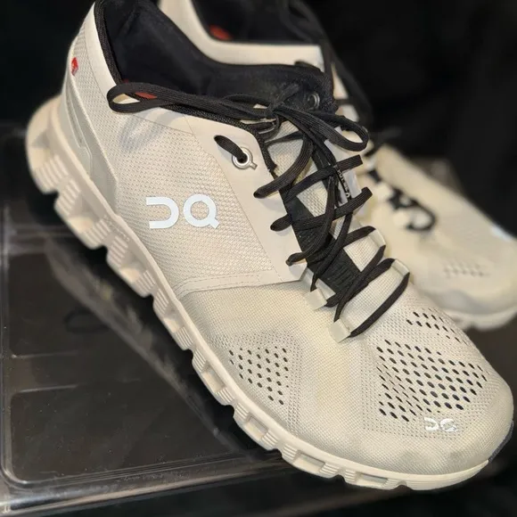 On Running White and Black Sneakers with Cloud Cushioning