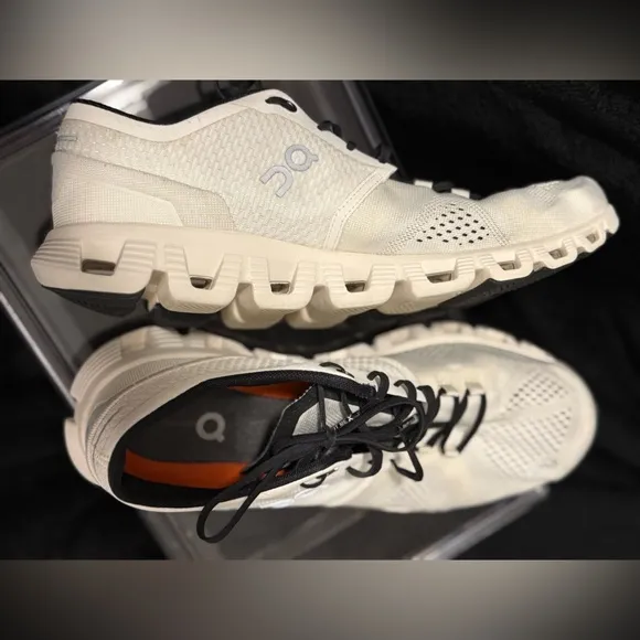 On Running White and Black Sneakers with Cloud Cushioning