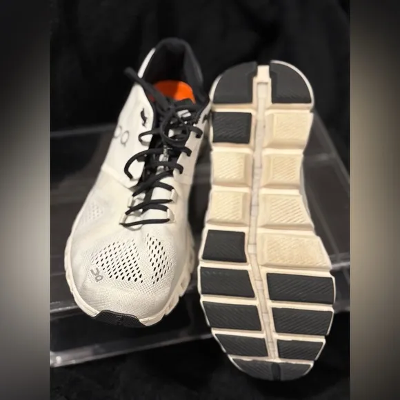 On Running White and Black Sneakers with Cloud Cushioning