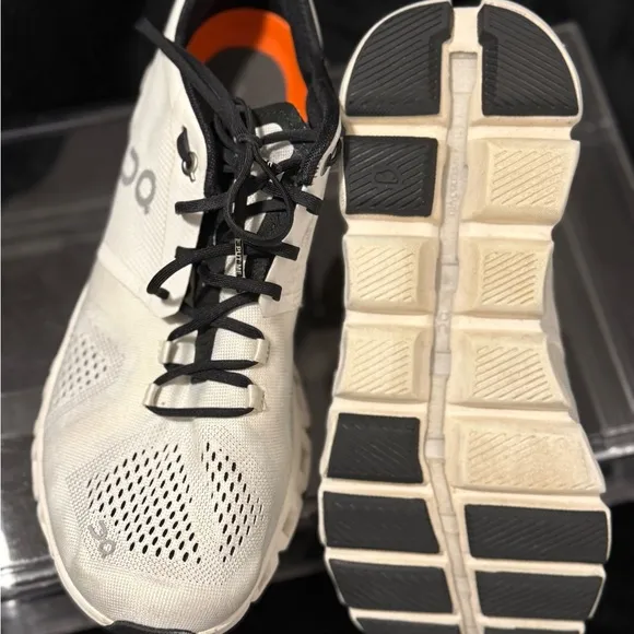 On Running White and Black Sneakers with Cloud Cushioning