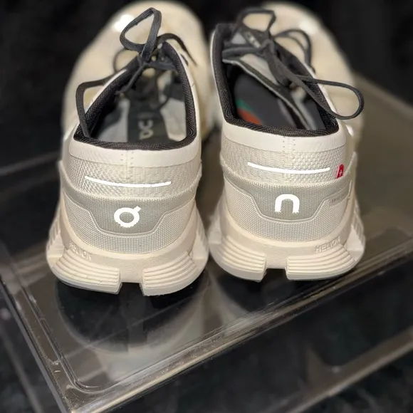 On Running White and Black Sneakers with Cloud Cushioning