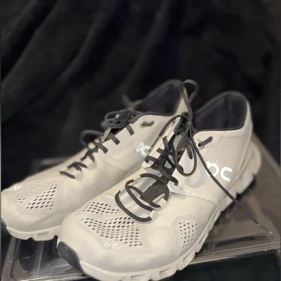 On Running White and Black Sneakers with Cloud Cushioning