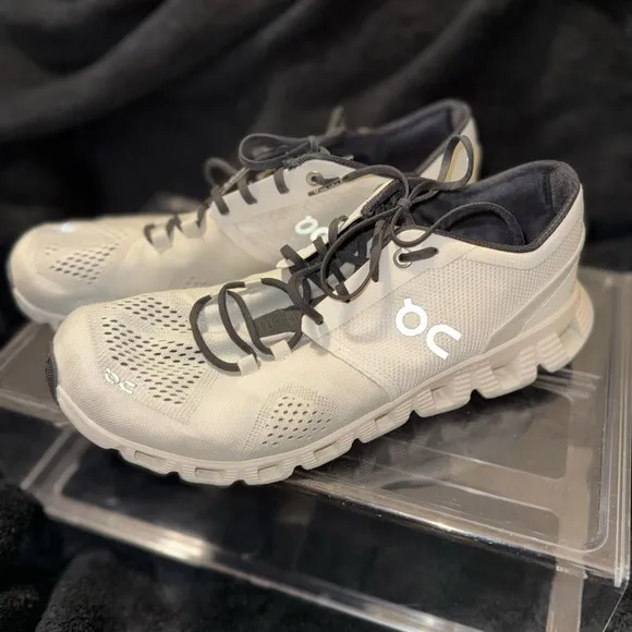 On Running White and Black Sneakers with Cloud Cushioning