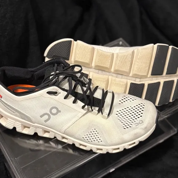 On Running White and Black Sneakers with Cloud Cushioning