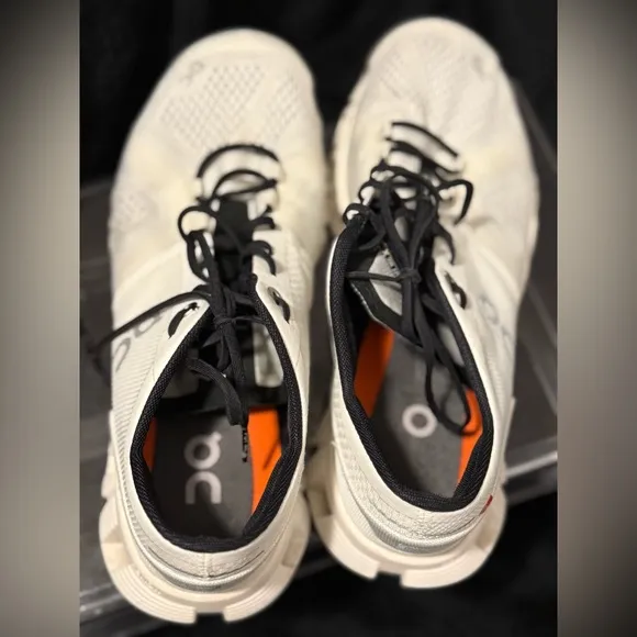 On Running White and Black Sneakers with Cloud Cushioning