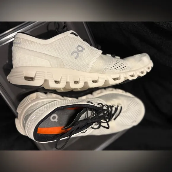 On Running White and Black Sneakers with Cloud Cushioning