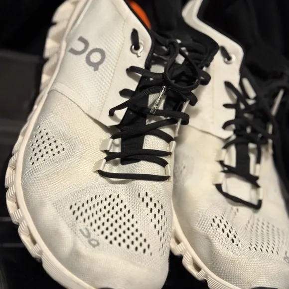 On Running White and Black Sneakers with Cloud Cushioning