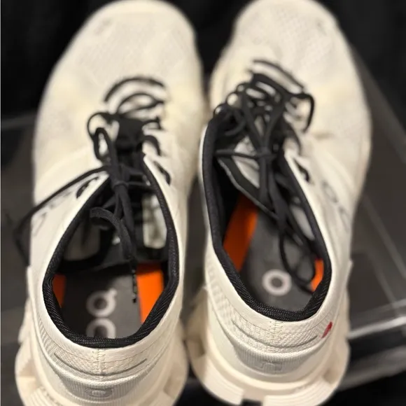 On Running White and Black Sneakers with Cloud Cushioning