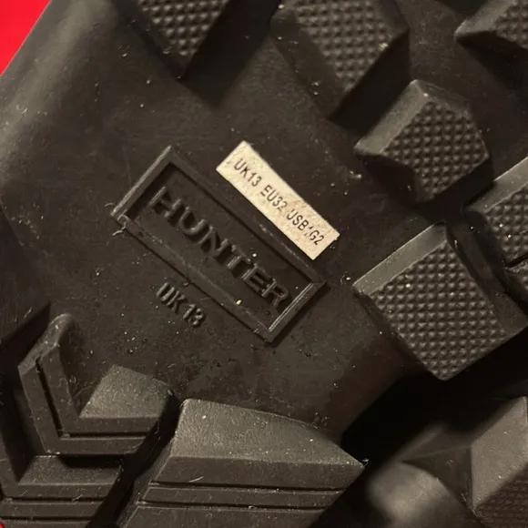 These are a pair of all black insulated Hunter snow boots size 1