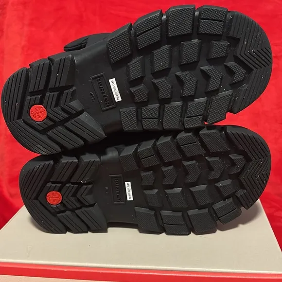 These are a pair of all black insulated Hunter snow boots size 1